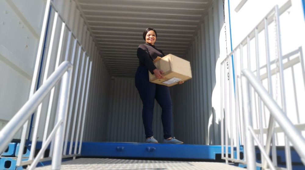 lady smiling in a container unit